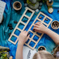 Child using Ocean Invitation to Play learning collection to sort and pattern wooden animal figures, supporting hands-on math and early years learning